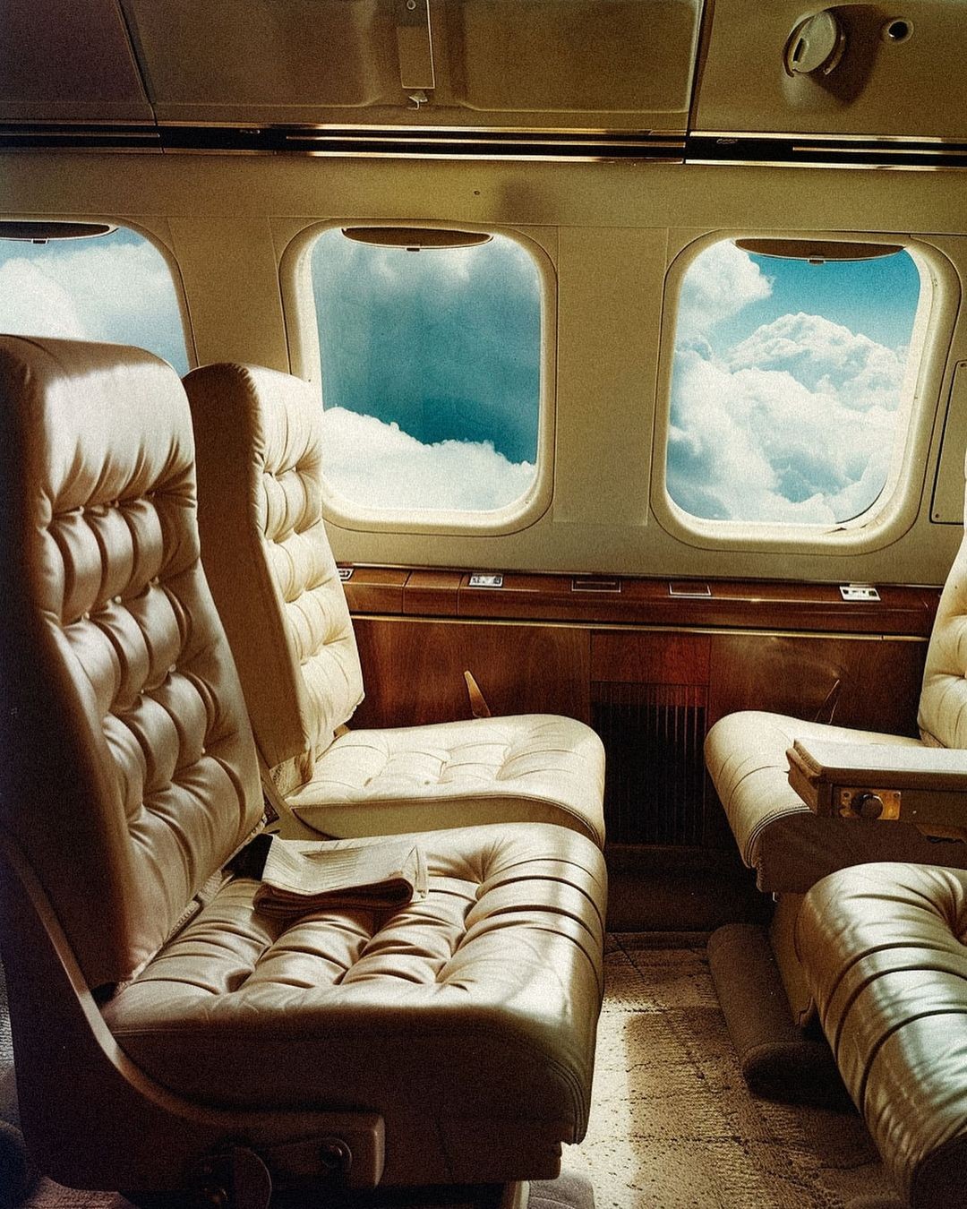 Photo of a man giving a talk on stage with blue curtains behind him.